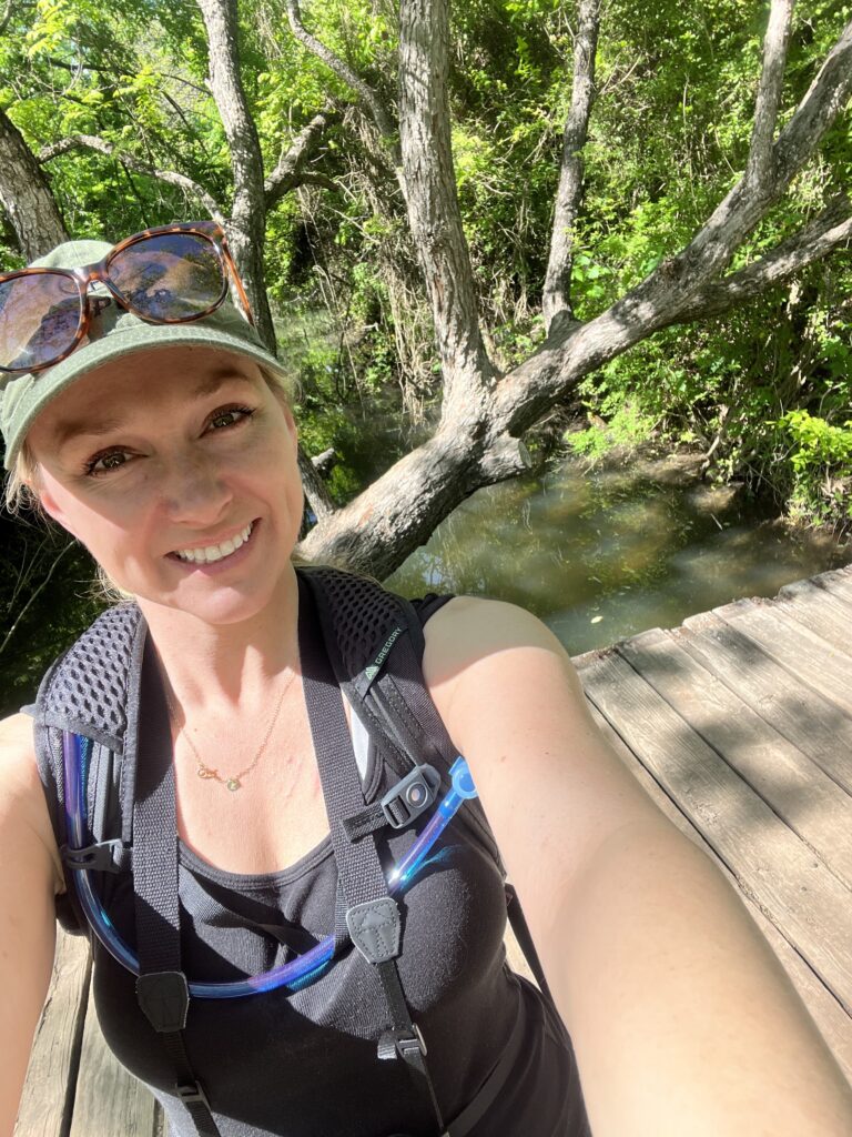 Kathryn Alexander hiking at Emma Long Metropolitan Park, where you can find some of the best Austin hiking trails with water. Spring 2024